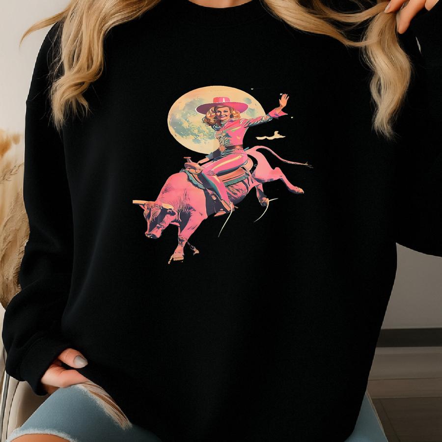 Pink Retro Cowgirl Riding Bull Art Print | Cosmic Cowgirl Wall Art, Vintage Rodeo Cowgirl Art, Surreal Southwest Western Desert Art Prints Sweatshirt