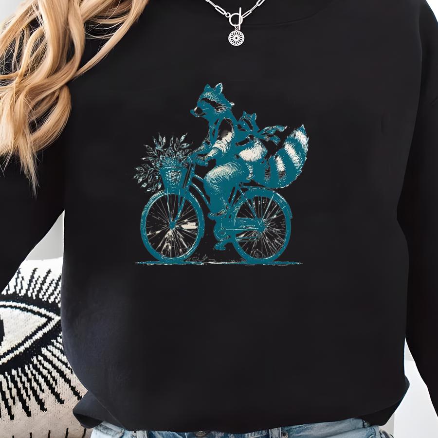 Funny Raccoon Bicycle T-shirt: Quirky Animal Lover Tee Sweatshirt
