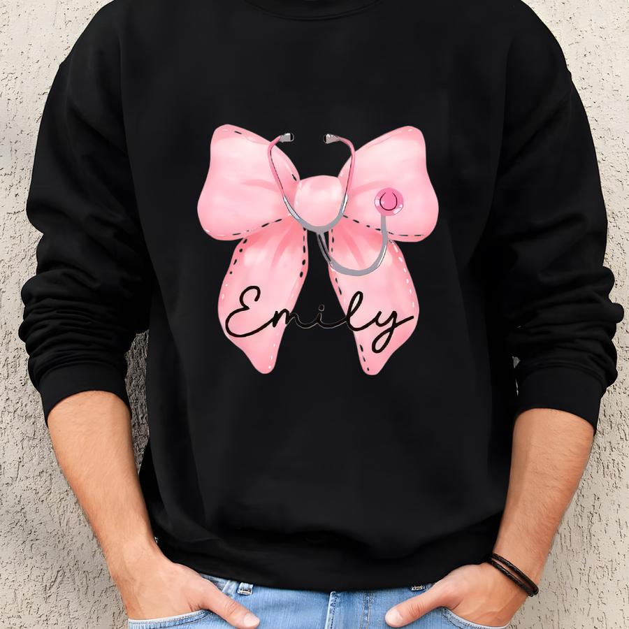 Custom Name Gift For Nurses, Healthcare Workers Sweatshirt, Pink Bow Stethoscope Pocket Design, Nurse Bow Shirt, Coquette Nurse Sweatshirt Sweatshirt