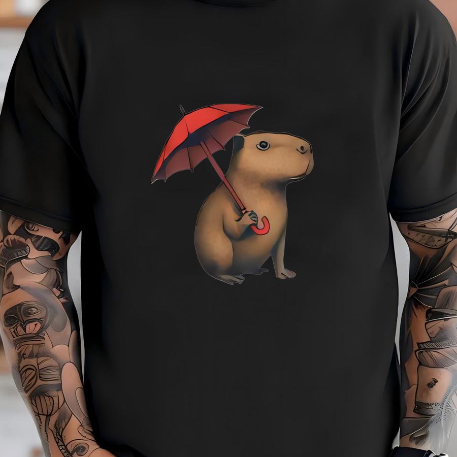 Capybara In The Rain Holding An Umbrella Shirt Cozy Umbrella Animal Tee | Wholesome Weirdcore Graphic T-shirt