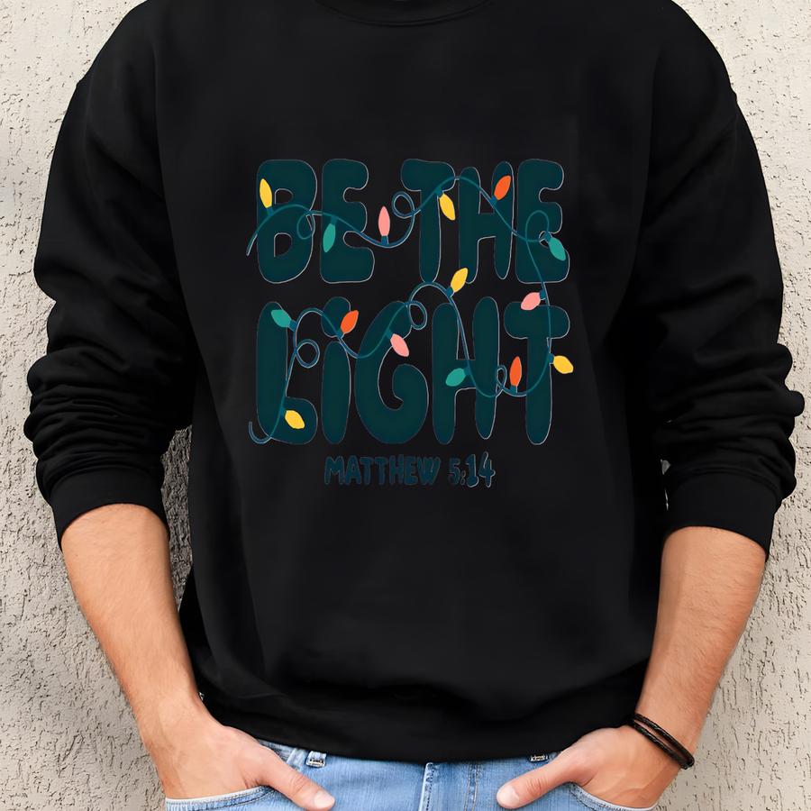 Be The Light Sweatshirt | Christian Matthew 5:14 | Bible Verse Christmas Apparel | Religious Holiday Gift | Faithful Christmas Crewneck Sweatshirt