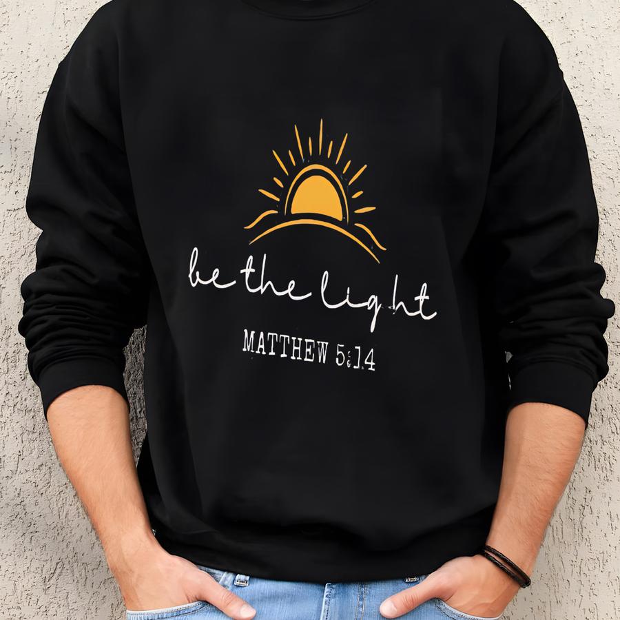 ® Be The Light Christian Shirt, Religious Christmas Tee, Bible Verse T-shirt, Jesus Lover Shirt, Holiday Faith Sunlight Top Sweatshirt